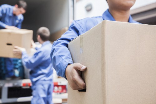 Team using safe lifting practices during a moving job