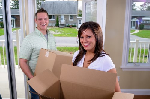 Packed moving boxes and furniture for a Battersea house move