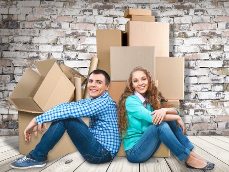 Removal van and moving boxes in a Battersea street setting