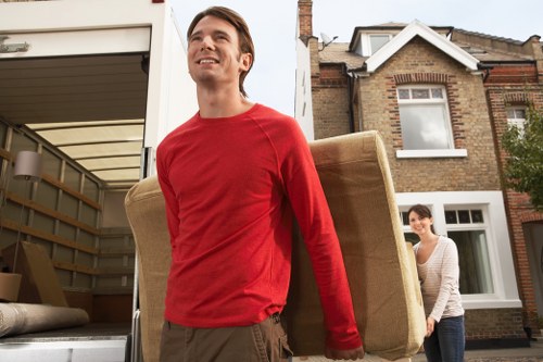 Unpacking boxes in a Battersea apartment after a move