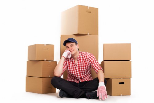Professional movers handling boxes and furniture during a Battersea relocation